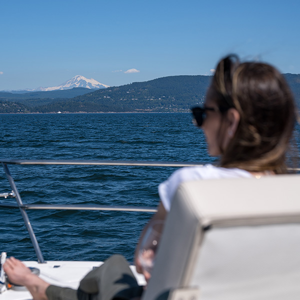 relaxing on a yacht with a view of Mt Rainier